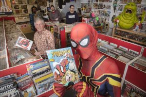 Spiderman drops in at Rhyl Comic and Disc Co to meet, from left, owner and comic expert Stuart Stevenson and staff members Shaun Johnson and Tom Ellis.